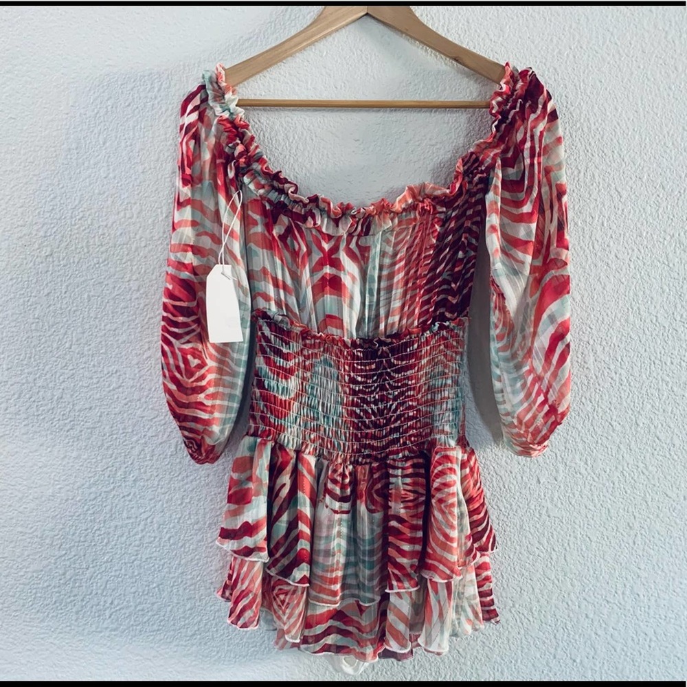 Boutique NWT off shoulder long sleeve pink pattern romper small